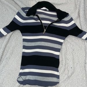 V Zip Up blue, white, and black shirt